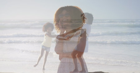 Digital composite image of caucasian female athlete running against sports field. Patriotism and celebration concept digitally generated image.の写真素材