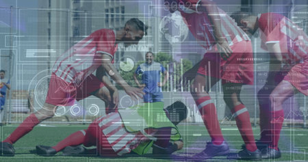 Image of statistics and data processing over diverse football players on pitch. Sports, competition and data processing concept digitally generated image.の写真素材