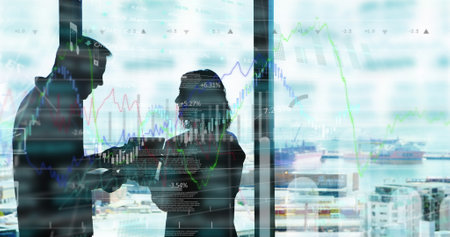 Image of statistics and financial data processing over diverse business people in office. Global business, data processing and digital interface concept digitally generated image.の写真素材
