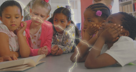 Image of lightning over diverse schoolchildren and teacher. Global education and digital interface concept digitally generated image.の写真素材