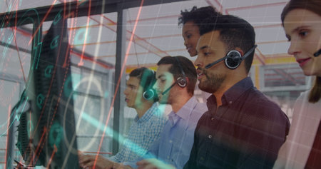 Image of data processing over team of diverse customer care executives working at office. Business data and analytics technology conceptの写真素材