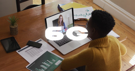 Image of 6g text banner over african american woman having a image call on laptop at home. Global networking and business technology conceptの写真素材