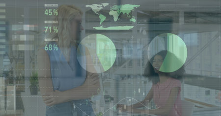Image of data processing over diverse businesswomen in office. Global business and digital interface...