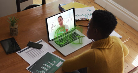 Image of 6g text banner over african american woman having a image call on laptop at home. Global...