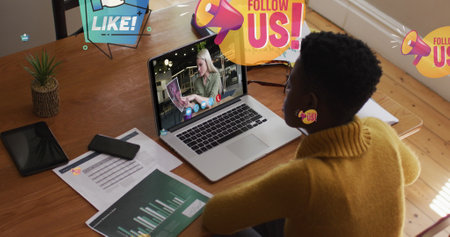Image of follow us over african american woman having image call on laptop. Business, home office,...
