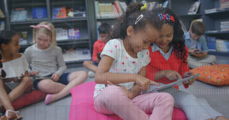 Image of hud processing over multiracial elementary students using digital tablets in classroom....