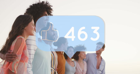 Image of speech bubble with increasing likes over diverse friends posing for a picture at beach. Social media networking technology conceptの写真素材