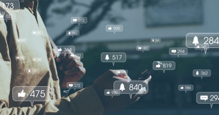 Image of data processing and social media speech bubbles over man using smartwatch. Computer...
