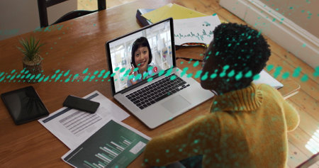 Image of online using laptop and smiling unk using laptop. Global business digital interface...