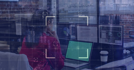 Image of data processing over businesswoman using laptop at office. Global business, computing and...