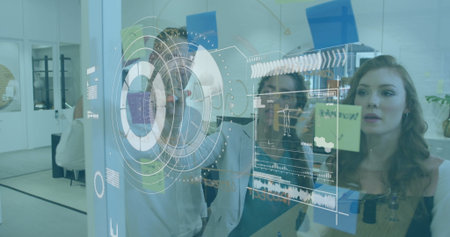 Image of scope scanning over businessman using laptop. Global business digital interface technology and networking concept digitally generated image.の写真素材