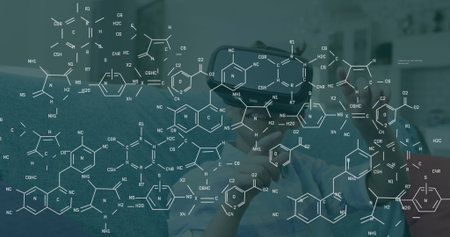 Man wearing VR headset exploring molecular structures in lab workspace, with graphics overlays. Futuristic, innovation, science, technology, digital, immersive, researchの写真素材