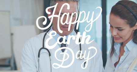 Doctor in lab coat and patient reviewing file at clinic, with stethoscope and Earth Day whiteboard. Medical, healthcare, consultation, professionalism, wellness, collaboration, brightの写真素材
