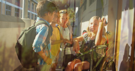 Laughing four classmates chatting in sunlit school corridor, with wheelchair backpacks smartphone....