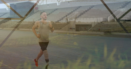 Running male athlete sprinting on blue track in stadium, with prosthetic blade and fitness watch....