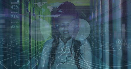 Monitoring woman IT technician in shirt checking tablet in server rack aisle, with HUD overlays. Technology, data analytics, cybersecurity, networking, innovation, digital, professionalの写真素材