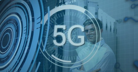 Standing telecom engineer crossing arms in data center with racks, cables and 5G overlay copy space....