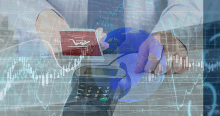 Businessperson's hands raising smartphone above card reader on counter with red cart icon, globe....