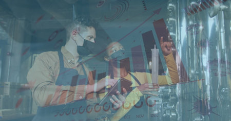 Examining masked technicians holding graduated cylinder and using smartphone at craft brewery tank....