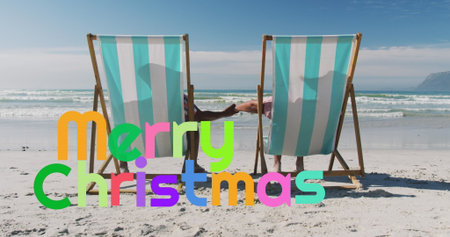 Leaning back couple wearing swimwear holding hands on beach, with striped deck chairs. Relaxation, leisure, vacation, seaside, outdoor, friendship, serenityの写真素材