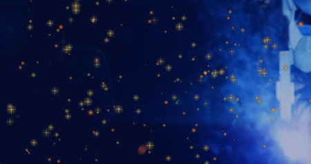 Holding torch, welder creating sparks on metal surface at shop with helmet and gloves, copy space. Industrial, craftsmanship, safety, precision, sparks, atelier, machineryの写真素材