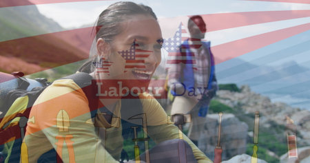 Laughing woman hiking rocky trail with boots and backpack while friend pausing above calm bay. Adventure, exploration, outdoor, rugged, nature, fitness, teamworkの写真素材