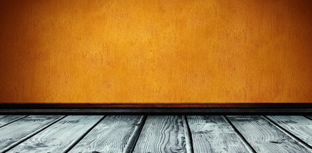 Close up of empty shelf on orange wallの写真素材