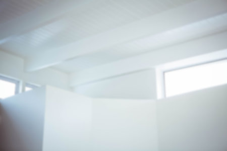 Low angle view of white wall against ceiling at homeの写真素材