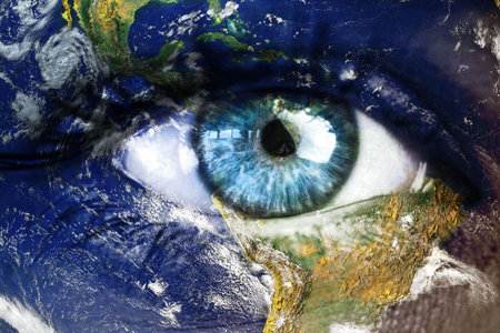 Digital illustration is merging blue eye with satellite Earth view, showing continents and clouds....