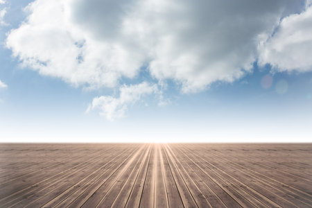Wooden deck is stretching in flat design toward glowing horizon with cloudy sky and lens flare. Minimalist, expansive, scenic, outdoor, natural, tranquil, linearの写真素材