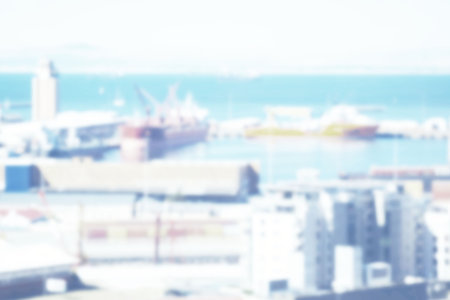 Image of blurred port with ships and buildings. Travel, landscape and transport concept digitally...