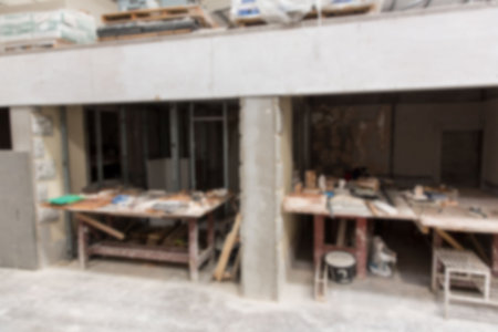 Concrete support column is standing in flat design construction site, showing power tools, buckets....