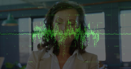 Analyzing woman interpreting holographic data display in office, with green waveform and numbers....