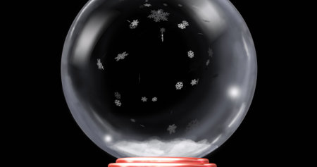 Resting glass globe containing white granules, snowflakes on red base at product photography setup. Minimalist, elegant, artistic, luxury, reflective, winter, seasonalの写真素材