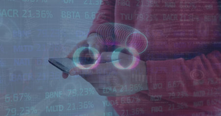 Man wearing red sweater holding smartphone at chest in grey studio, with AR rings and codes....