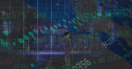 Standing businesswoman wearing grey suit facing window in office with briefcase and ticker overlays. Corporate, finance, technology, professional, urban, digital, modernの写真素材