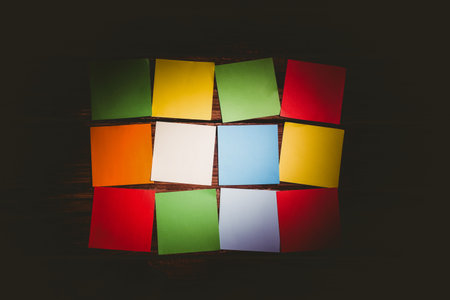 Directly above shot of colorful papers arranged on wooden floor