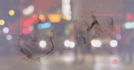 Floating two crumpled forms over city street at night, with digital reticles and blurred headlights....