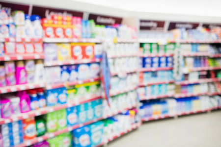Various products for sale arranged on shelves at supermarketの写真素材