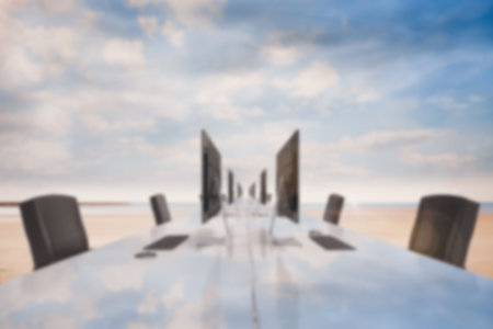 Illustration of office desk and chairs against cloudy skyの写真素材