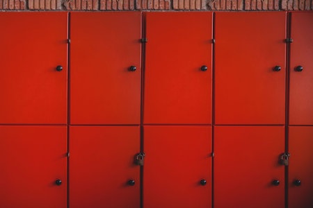 Close-up of orange lockers in schoolの写真素材