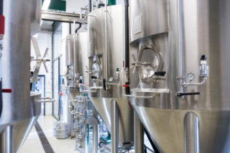 Beer manufacturing machinery arranged in row at factory