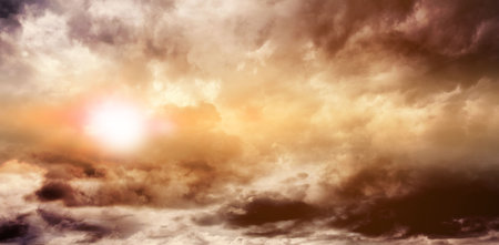 Low angle view of cloudy sky during sunsetの写真素材