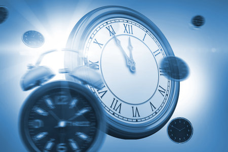 Digital image of alarm and wall clocks against white backgroundの写真素材