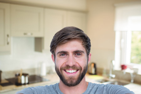Portrait of man in kitchen at homeの写真素材