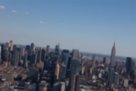 Blurry view of cityscape during summerの写真素材