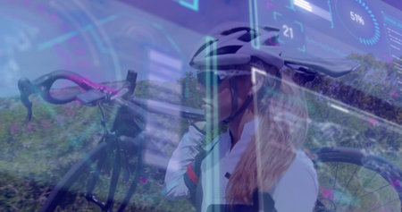 Shouldering bicycle cyclist moving along roadside path, with helmet sunglasses gloves data overlay....