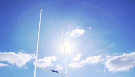 Vector white rugby goalposts are standing against blue sky, showcasing green-blue padded crossbar. Sports, outdoor, athletic, stadium, equipment, active, motionの写真素材