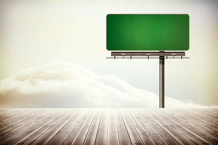 Green sign over wooden boardsの写真素材