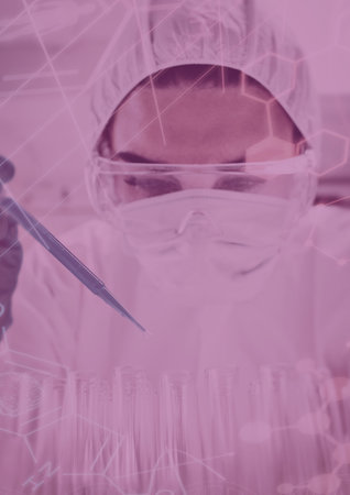 Scientist dropping the reagent into test tube for reaction testing in chemical laboratoryの写真素材